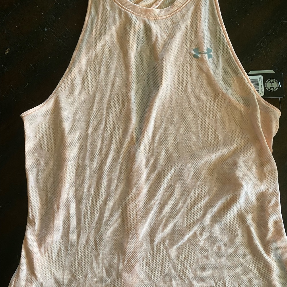 Under armour. Size medium. Never warn.